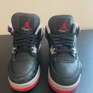 Black and Red Sneakers with Iconic Logo